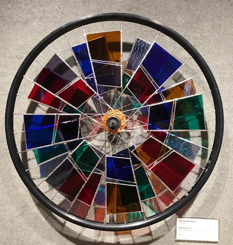 bicycle wheel with stained glass in the spokes
